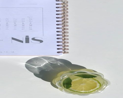 healthy morning routine concept with notebook water glass and soft light